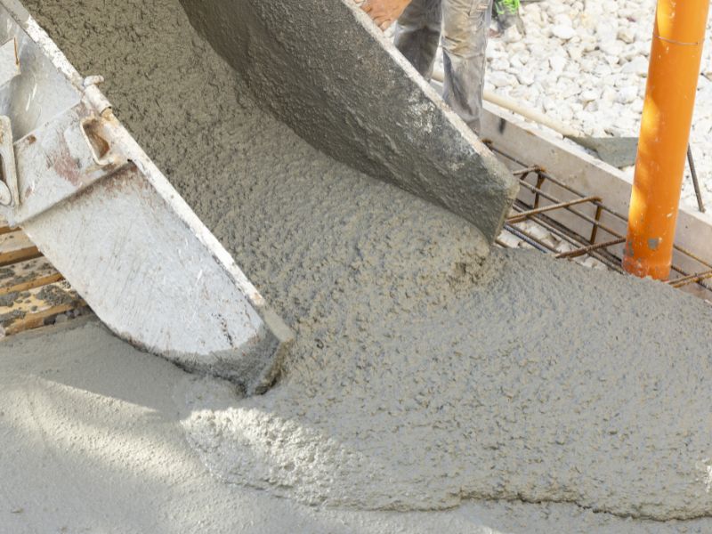 concrete being poured from a mixer for a foundation in San Antonio
